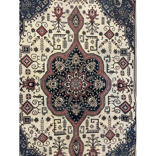 1554 - An early 20th century Northwest Persian Islamic Tabriz floor carpet rug having a flower shaped centr... 