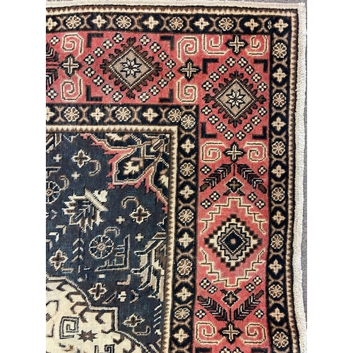 1554 - An early 20th century Northwest Persian Islamic Tabriz floor carpet rug having a flower shaped centr... 