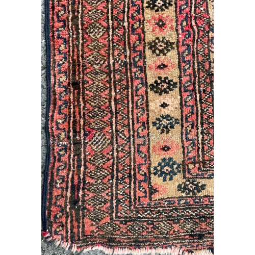 1569 - An vintage mid 20th century Afghan Bukhara floor carpet rug having a series of repeating central med... 