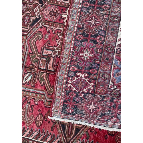 1638 - An early 20th century Northwest Persian Islamic Heriz floor carpet rug having n intricate central me... 