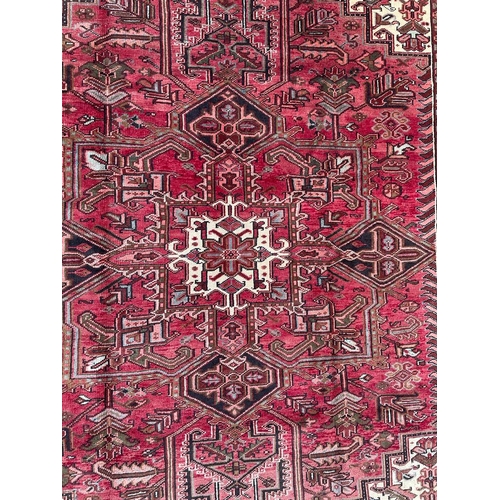 1638 - An early 20th century Northwest Persian Islamic Heriz floor carpet rug having n intricate central me... 