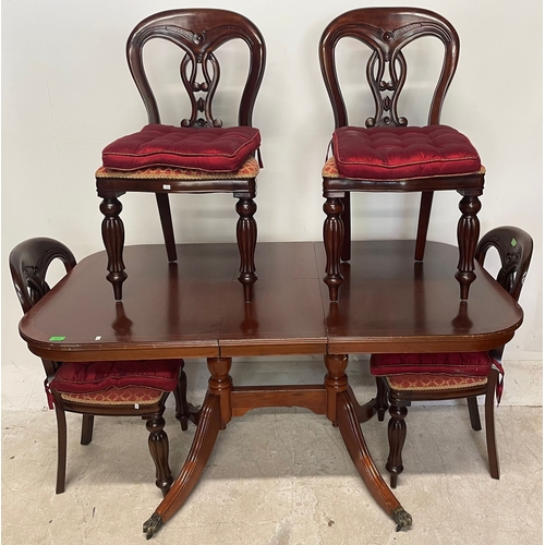 1661 - A 20th century Victorian revival mahogany dining table and four chairs. The chairs each having pierc... 