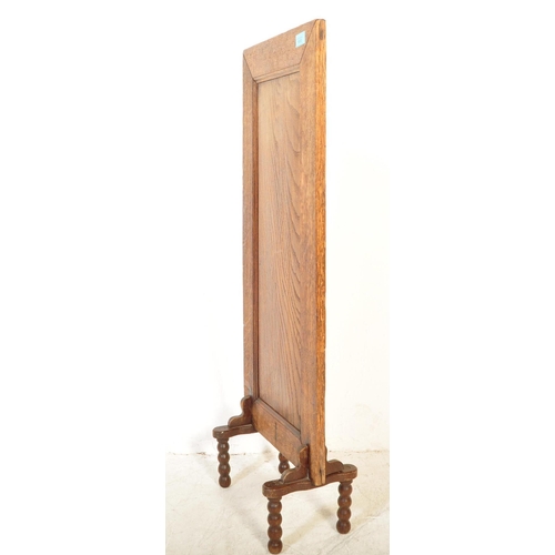 1690 - A 1930s William & Mary revival upright tall panel oak fire / discretion screen. The panelled rectang... 