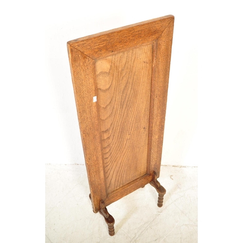 1690 - A 1930s William & Mary revival upright tall panel oak fire / discretion screen. The panelled rectang... 