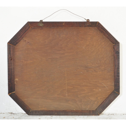 1693 - An early 20th century mahogany framed wall hanging mirror of octagonal form hanging lozenge shaped m... 