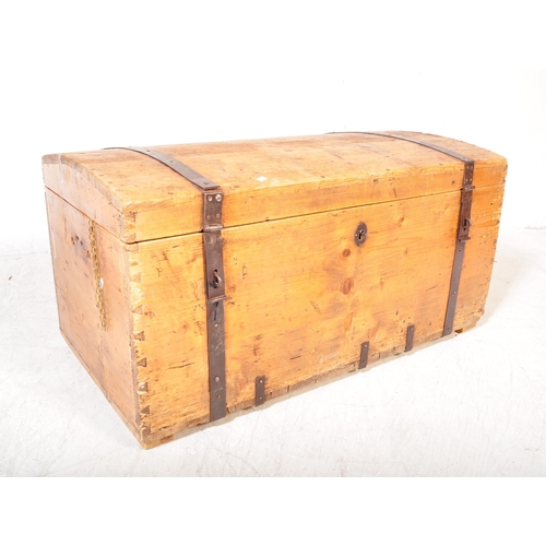 1696 - A 19th century Victorian pine dome top blanket box chest. The chest having a domed lid with metal ba... 