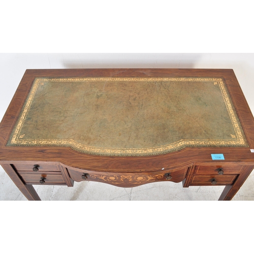 1706 - Edwardian rosewood and leather inlaid writing table desk. Raised on square tapering legs with arched... 