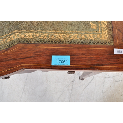 1706 - Edwardian rosewood and leather inlaid writing table desk. Raised on square tapering legs with arched... 