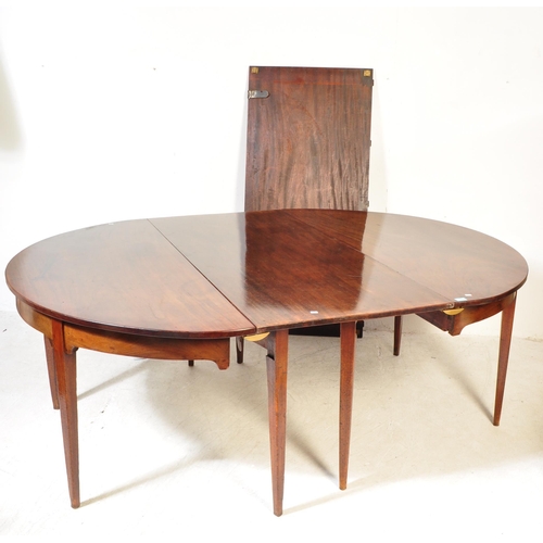 1714 - A 19th century George III mahogany extending D-End dining table. The table having two leaves being r... 