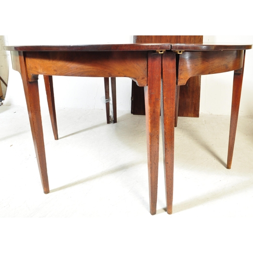 1714 - A 19th century George III mahogany extending D-End dining table. The table having two leaves being r... 