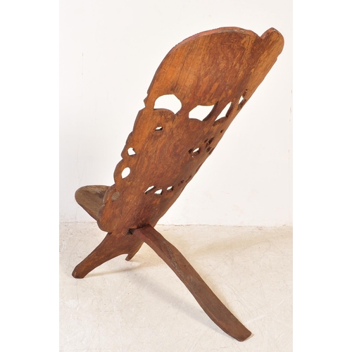 1716 - An early 20th century hardwood African birthing chair being formed of two interlocking sections of w... 