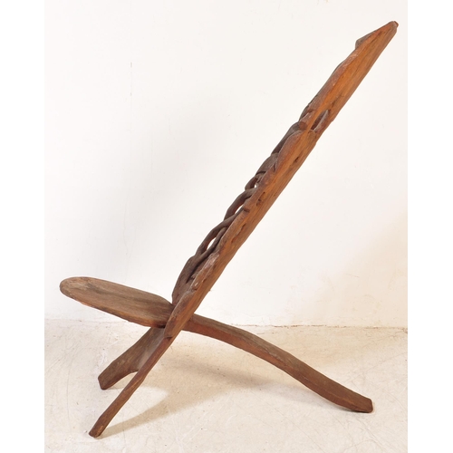 1716 - An early 20th century hardwood African birthing chair being formed of two interlocking sections of w... 