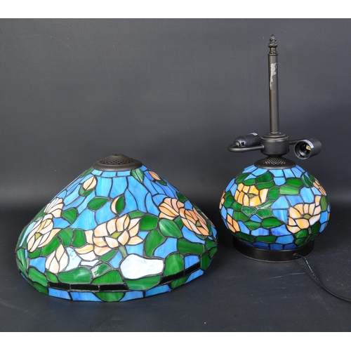 1723 - Two vintage 20th century Tiffany manner stained and leaded glass matching ceiling light and table la... 