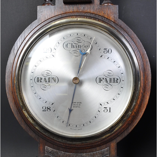 1725 - An early 20th century oak case banjo barometer having top with canted edges and faceted diamond reli... 