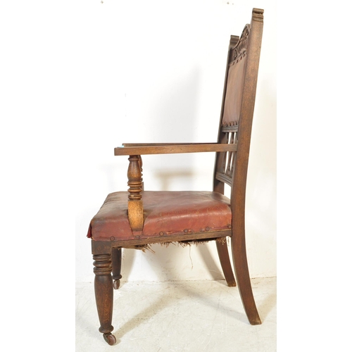 1734 - A late 19th Century Arts & Crafts oak carved hall chair. Having an arched carved top flanked by fini... 