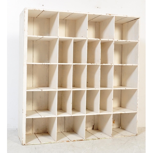 1737 - A vintage 20th Century painted pine wood pigeon hole shelving wall unit. Of rectangular form with fi... 