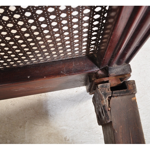 1747 - A early 20th Century Bergere mahogany bed frame. Having a curved threaded frame around cane / wicker... 