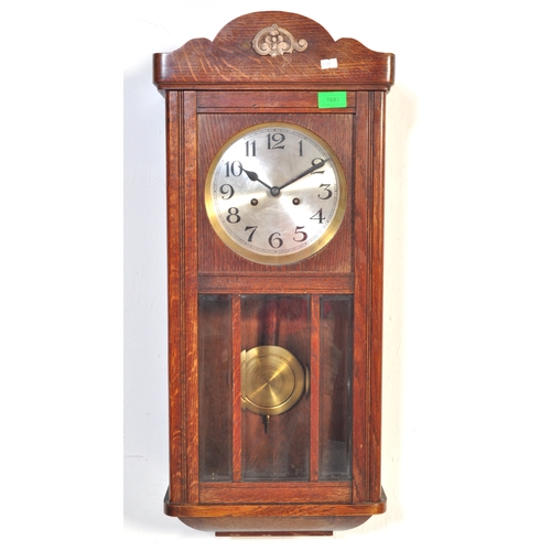 1753 - A vintage early 20th Century oak wall clock and two regency revival items. 

The clock having a silv... 