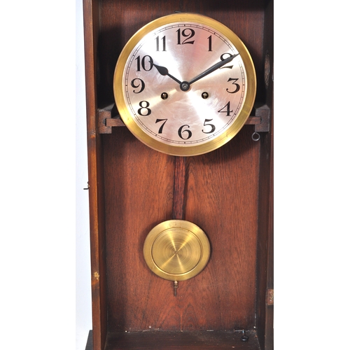 1753 - A vintage early 20th Century oak wall clock and two regency revival items. 

The clock having a silv... 