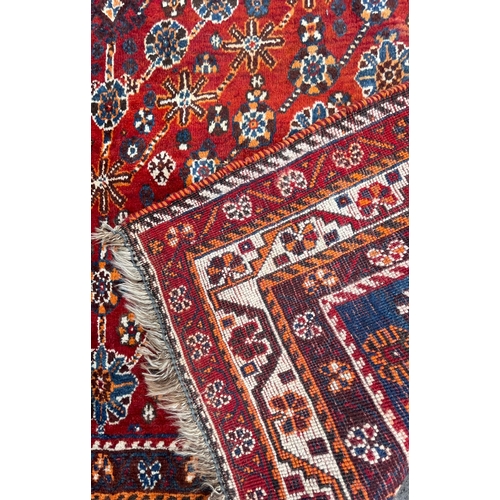 1754 - An vintage mid 20th century circa 1950s Persian Islamic Qashqai floor carpet rug having graduating c... 