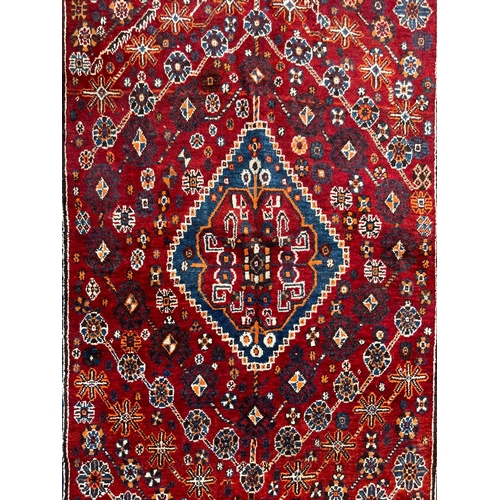 1754 - An vintage mid 20th century circa 1950s Persian Islamic Qashqai floor carpet rug having graduating c... 