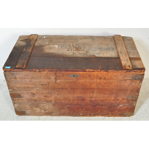 1755 - An early 20th Century large wood travellers chest / trunk. Of rectangular form with brass key, metal... 