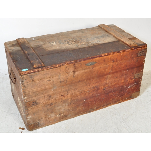 1755 - An early 20th Century large wood travellers chest / trunk. Of rectangular form with brass key, metal... 