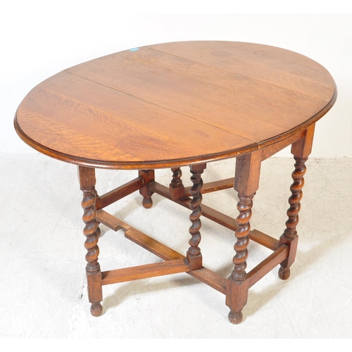 1757 - A 19th Century Victorian oak gateleg table with x2 drop leaves. The table having two swing out gate ... 