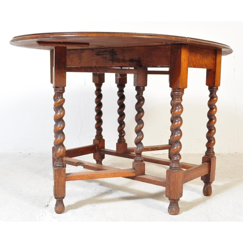 1757 - A 19th Century Victorian oak gateleg table with x2 drop leaves. The table having two swing out gate ... 