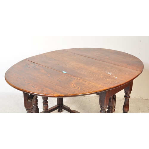 1759 - A 19th century oak drop leaf Pembroke dining table. The table having an oval top when extended with ... 