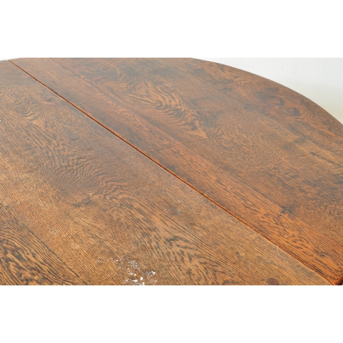 1759 - A 19th century oak drop leaf Pembroke dining table. The table having an oval top when extended with ... 