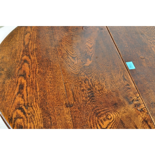 1759 - A 19th century oak drop leaf Pembroke dining table. The table having an oval top when extended with ... 