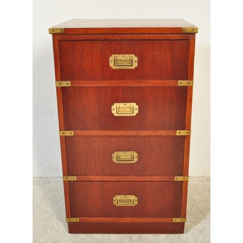 1761 - A 20th Century campaign style mahogany chest of drawers. A four drawer configuration with recessed h... 