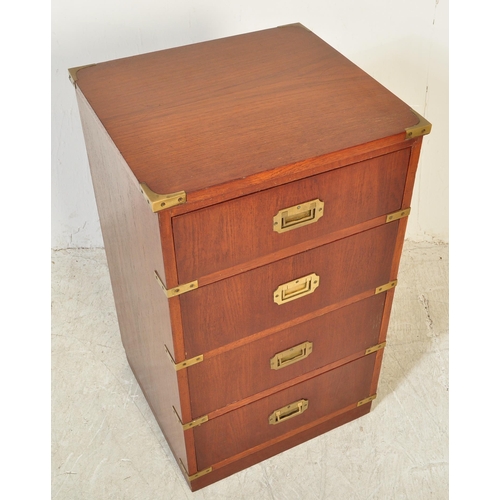 1761 - A 20th Century campaign style mahogany chest of drawers. A four drawer configuration with recessed h... 