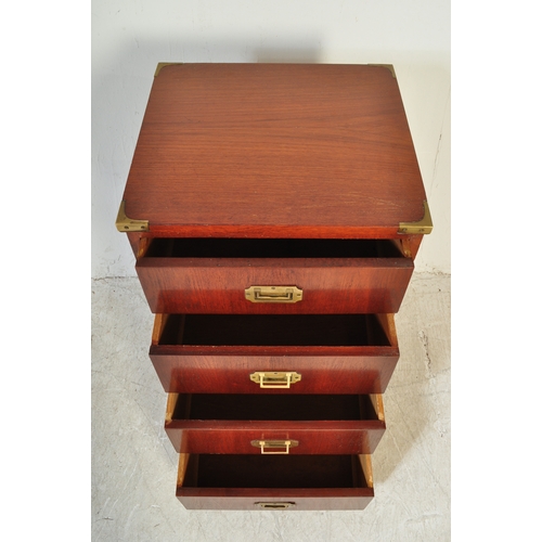 1761 - A 20th Century campaign style mahogany chest of drawers. A four drawer configuration with recessed h... 