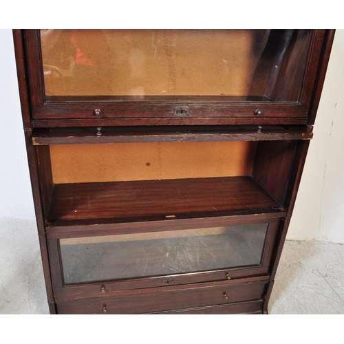 1765 - Harris Lebus - 'The Lebus Bookcase' - An early 20th century mahogany barristers bookcase having a se... 