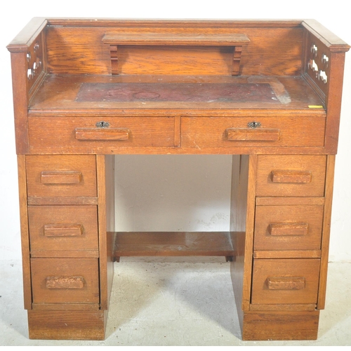 1773 - 1920's oak Arts & Crafts twin pedestal desk having pierced gallery surround top with leather inset o... 