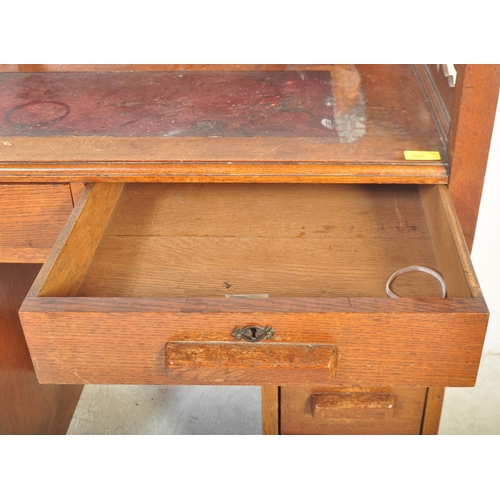 1773 - 1920's oak Arts & Crafts twin pedestal desk having pierced gallery surround top with leather inset o... 