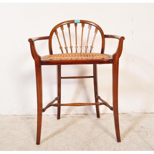 1776 - A late 19th century early 20th century Edwardian mahogany wicker weave piano seat stool having a bow... 