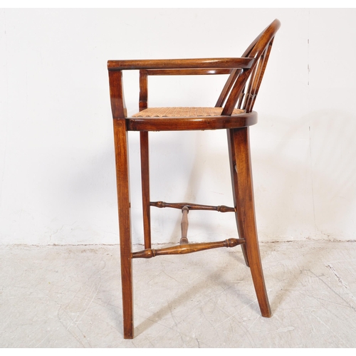 1776 - A late 19th century early 20th century Edwardian mahogany wicker weave piano seat stool having a bow... 