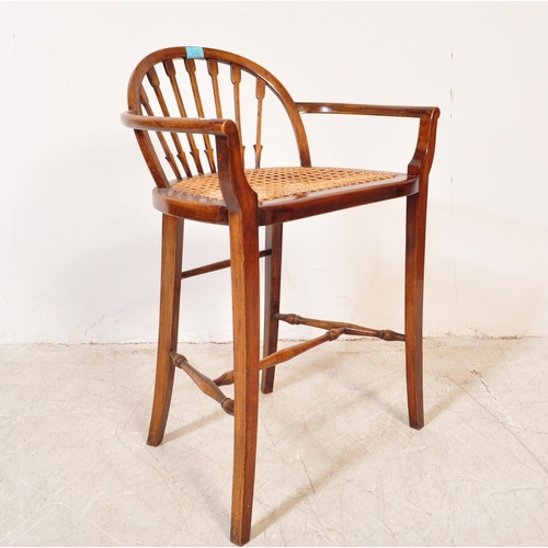 1776 - A late 19th century early 20th century Edwardian mahogany wicker weave piano seat stool having a bow... 