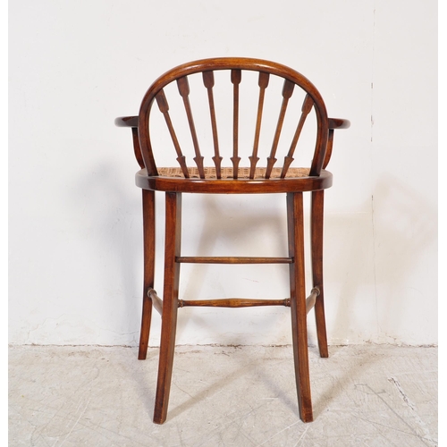 1776 - A late 19th century early 20th century Edwardian mahogany wicker weave piano seat stool having a bow... 