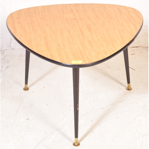 1254 - A retro mid 20th century teak veneer coffee table in a triangular form. Having ebonised angular tape... 