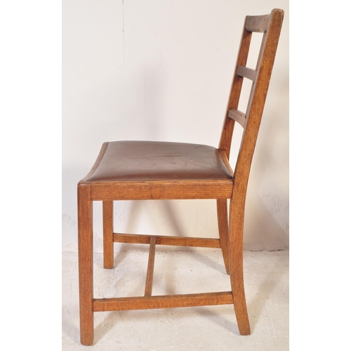 1712 - A 1930's oak refectory draw leaf dining table and set of 4 chairs. The table with squared chamfered ... 