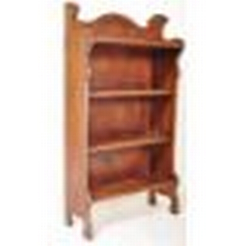 1577A - An early 20th Century oak Arts and Crafts open fronted book case. The bookcase having a shaped galle... 