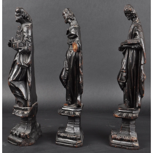 117 - A set of three 19th Century carved religious ecclesiastical figurines. Each modelled raised on pedes... 