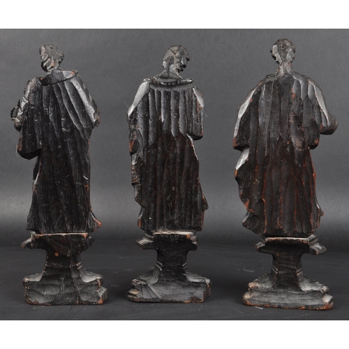 117 - A set of three 19th Century carved religious ecclesiastical figurines. Each modelled raised on pedes... 