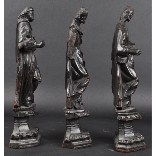 117 - A set of three 19th Century carved religious ecclesiastical figurines. Each modelled raised on pedes... 