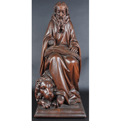 119 - A 20th century carved seated statue of Saint Jerome. An ornately carved with fine detailing, posed s... 