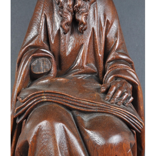 119 - A 20th century carved seated statue of Saint Jerome. An ornately carved with fine detailing, posed s... 
